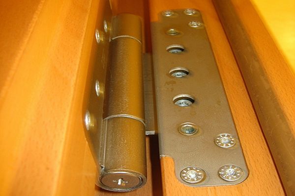 Close-up of deluxe wood door hinge