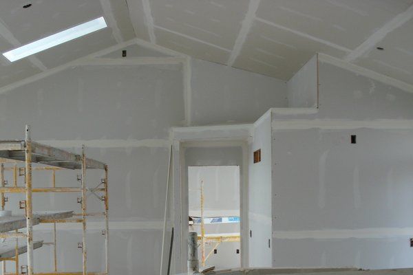 New home drywall installation with skylights